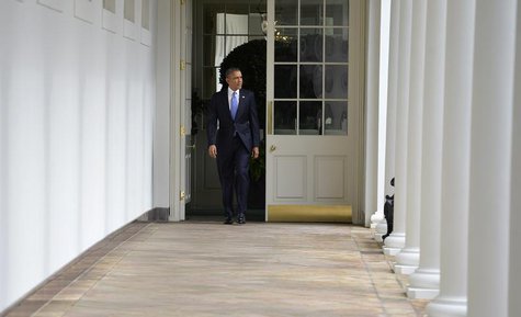 U.S. President Barack Obama walks the colonnade from the residence of the White House to the Oval Office in the West Wing, to continue work U.S. President Barack Obama walks the colonnade from the residence of the White House to the Oval Office in the West Wing, to continue work