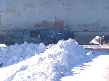 A man suffered non-life threatening injuries after his pickup truck collided with a train in Calumet County, Tuesday, Jan. 28, 2014. (Photo from FOX 11). A man suffered non-life threatening injuries after his pickup truck collided with a train in Calumet County, Tuesday, Jan. 28, 2014. (Photo from FOX 11).