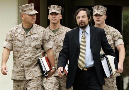 U.S. Marine Sgt. Lawrence G. Hutchins III (back R) arrives with his civilian defence counsel J. Richardson Brannon (front R) and military defence counsel Lt Col Joseph S. Smith (front L) and Captain Alan Bass for his Article 32 Investigation hearing at Camp Pendleton, California, in this October 16, 2006 file photo.
CREDIT: REUTERS/MIKE BLAKE/FILES U.S. Marine Sgt. Lawrence G. Hutchins III (back R) arrives with his civilian defence counsel J. Richardson Brannon (front R) and military defence counsel Lt Col Joseph S. Smith (front L) and Captain Alan Bass for his Article 32 Investigation hearing at Camp Pendleton, California, in this October 16, 2006 file photo.
CREDIT: REUTERS/MIKE BLAKE/FILES
