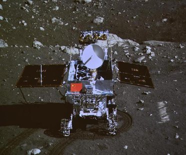A photograph of the giant screen at the Beijing Aerospace Control Center shows photo of the Yutu, or "Jade Rabbit" lunar rover taken by the A photograph of the giant screen at the Beijing Aerospace Control Center shows photo of the Yutu, or "Jade Rabbit" lunar rover taken by the