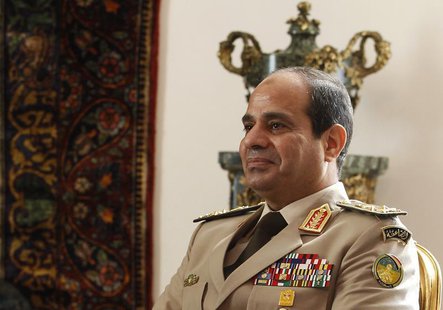 Egypt's Army Chief General Abdel Fattah al-Sisi attends a meeting with Egypt's interim President Adly Mansour, Russia's Defence Minister Ser Egypt's Army Chief General Abdel Fattah al-Sisi attends a meeting with Egypt's interim President Adly Mansour, Russia's Defence Minister Ser