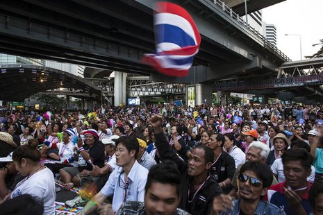 Anti-government protesters react as protest leader Suthep Thaugsuban (not pictured) speaks during a rally in central Bangkok, January 28, 20 Anti-government protesters react as protest leader Suthep Thaugsuban (not pictured) speaks during a rally in central Bangkok, January 28, 20