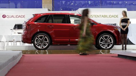 A model walks past a 2011 Ford Edge at the 26th International Automobile Trade Show in Sao Paulo October 25, 2010. REUTERS/Paulo Whitaker A model walks past a 2011 Ford Edge at the 26th International Automobile Trade Show in Sao Paulo October 25, 2010. REUTERS/Paulo Whitaker