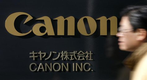 A man walks past a Canon Inc. sign at the company's headquarters in Tokyo January 14, 2009. REUTERS/Stringer A man walks past a Canon Inc. sign at the company's headquarters in Tokyo January 14, 2009. REUTERS/Stringer