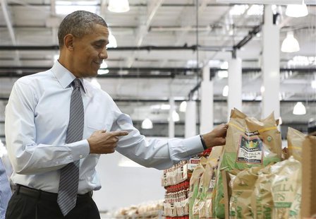 U.S. President Barack Obama holds up a bag of chips as he tours Costco Wholesale in Woodmore Towne Centre in Lanham, Maryland January 29, 20 U.S. President Barack Obama holds up a bag of chips as he tours Costco Wholesale in Woodmore Towne Centre in Lanham, Maryland January 29, 20