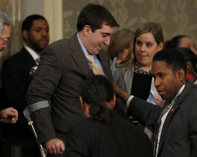Boston Marathon bombing survivor Jeff Bauman, who had to have both his legs amputated after being injured in the blasts, arrives before the Boston Marathon bombing survivor Jeff Bauman, who had to have both his legs amputated after being injured in the blasts, arrives before the