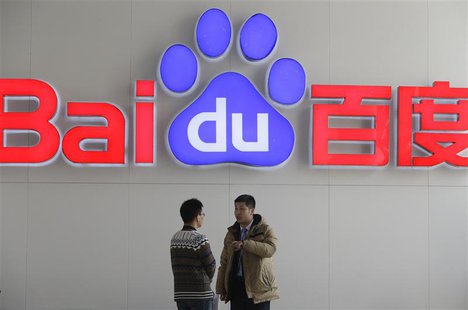 People talk in front of a Baidu's company logo at Baidu's headquarters in Beijing January 16, 2014. REUTERS/Jason Lee People talk in front of a Baidu's company logo at Baidu's headquarters in Beijing January 16, 2014. REUTERS/Jason Lee