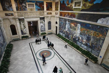 People at a mural by artist Diego Rivera at the Art Institute of Detroit in Detroit, Michigan December 3, 2013. REUTERS/Joshua Lott People at a mural by artist Diego Rivera at the Art Institute of Detroit in Detroit, Michigan December 3, 2013. REUTERS/Joshua Lott