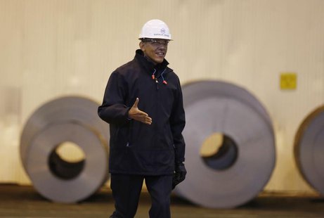 U.S. President Barack Obama extends his arm for a handshake as he tours the U.S. Steel Irvin Plant in West Mifflin, Pennsylvania, January 29 U.S. President Barack Obama extends his arm for a handshake as he tours the U.S. Steel Irvin Plant in West Mifflin, Pennsylvania, January 29