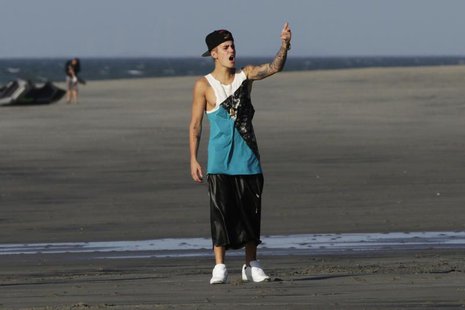 Canadian pop singer Justin Bieber gestures at a beach as he takes a break in a resort in Punta Chame, on the outskirts of Panama City Januar Canadian pop singer Justin Bieber gestures at a beach as he takes a break in a resort in Punta Chame, on the outskirts of Panama City Januar