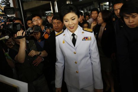 Thailand's Prime Minister Yingluck Shinawatra leaves the Army Club after meeting the Election Commission in Bangkok January 28, 2014. REUTER Thailand's Prime Minister Yingluck Shinawatra leaves the Army Club after meeting the Election Commission in Bangkok January 28, 2014. REUTER