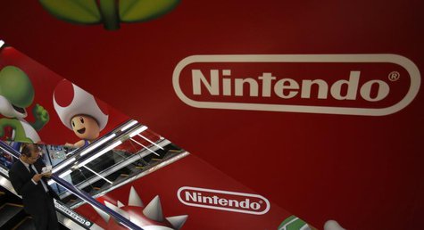 A shopper rides the escalator past Nintendo advertisements at an electronics retail store in Tokyo January 20, 2014. REUTERS/Yuya Shino A shopper rides the escalator past Nintendo advertisements at an electronics retail store in Tokyo January 20, 2014. REUTERS/Yuya Shino