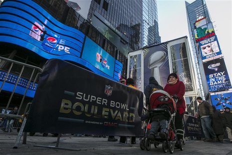 A woman walks through Times Square which has been transformed into Super Bowl Boulevard ahead of Super Bowl XLVIII in New York January 29, 2 A woman walks through Times Square which has been transformed into Super Bowl Boulevard ahead of Super Bowl XLVIII in New York January 29, 2