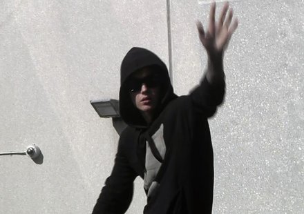 Pop singer Justin Bieber waves to fans as he leaves a jail after being released on bail in Miami, Florida in this still image taken from vid Pop singer Justin Bieber waves to fans as he leaves a jail after being released on bail in Miami, Florida in this still image taken from vid