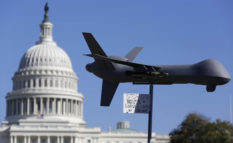 Demonstrators deploy a model of a U.S. drone aircraft at the "Stop Watching Us: A Rally Against Mass Surveillance" near the U.S. Capitol in Demonstrators deploy a model of a U.S. drone aircraft at the "Stop Watching Us: A Rally Against Mass Surveillance" near the U.S. Capitol in