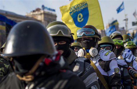 Members of various anti-government paramilitary groups gather at Independence Square during a show of force in Kiev, January 29, 2014. REUTE Members of various anti-government paramilitary groups gather at Independence Square during a show of force in Kiev, January 29, 2014. REUTE