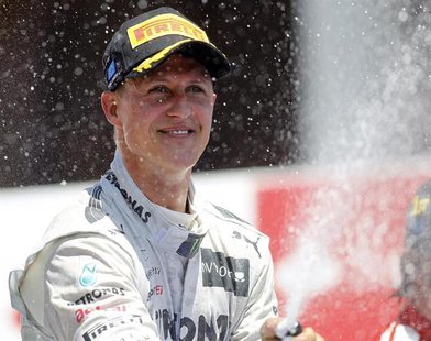 Mercedes Formula One driver Michael Schumacher of Germany sprays champagne during the podium ceremony after the European F1 Grand Prix at th Mercedes Formula One driver Michael Schumacher of Germany sprays champagne during the podium ceremony after the European F1 Grand Prix at th