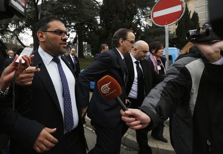 Members of the Syrian opposition delegation Anas al-Abdah (L) and Hadi al-Bahra (C) speak to journalists as they arrive for their first meet Members of the Syrian opposition delegation Anas al-Abdah (L) and Hadi al-Bahra (C) speak to journalists as they arrive for their first meet