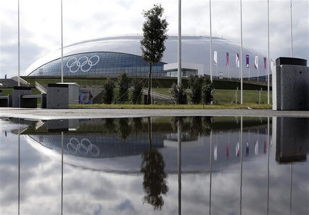 The Bolshoy Ice Dome is reflected in a puddle of water on the Olympic Park as preparations continue for the Sochi 2014 Winter Olympics, Janu The Bolshoy Ice Dome is reflected in a puddle of water on the Olympic Park as preparations continue for the Sochi 2014 Winter Olympics, Janu