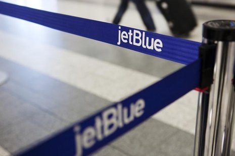 A JetBlue Airways logo is seen at the check-in counter at LaGuardia Airport in New York April 5, 2012. REUTERS/Lucas Jackson A JetBlue Airways logo is seen at the check-in counter at LaGuardia Airport in New York April 5, 2012. REUTERS/Lucas Jackson