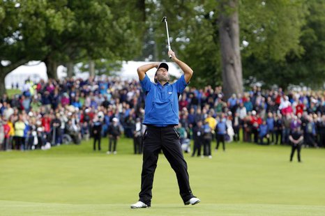 Italy's Edoardo Molinari reacts to his first putt on the eighteenth green before winning the Scottish Open golf tournament at Loch Lomond go Italy's Edoardo Molinari reacts to his first putt on the eighteenth green before winning the Scottish Open golf tournament at Loch Lomond go