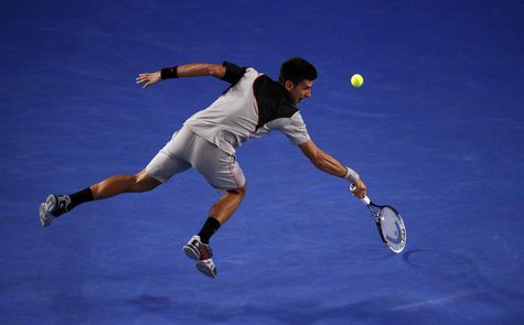 Novak Djokovic of Serbia hits a return to Stanislas Wawrinka of Switzerland during their men's singles quarter-final tennis match at the Aus Novak Djokovic of Serbia hits a return to Stanislas Wawrinka of Switzerland during their men's singles quarter-final tennis match at the Aus