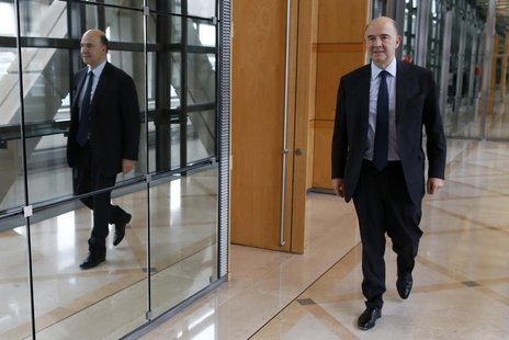 France's Finance Minister Pierre Moscovici leaves after an interview with Reuters at Bercy Finance Ministry in Paris, January 30, 2014. REUT France's Finance Minister Pierre Moscovici leaves after an interview with Reuters at Bercy Finance Ministry in Paris, January 30, 2014. REUT