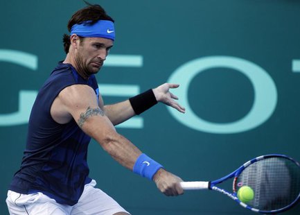 Carlos Moya of Spain returns the ball during his farewell exhibition tennis match against Guillermo Canas of Argentina in Buenos Aires, Dece Carlos Moya of Spain returns the ball during his farewell exhibition tennis match against Guillermo Canas of Argentina in Buenos Aires, Dece