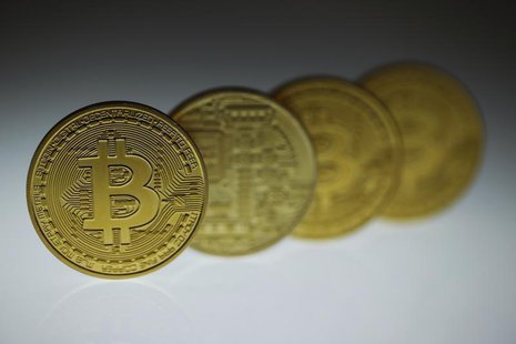 Mock Bitcoins are displayed on a table in an illustration picture taken in Berlin January 7, 2014. REUTERS/Pawel Kopczynski Mock Bitcoins are displayed on a table in an illustration picture taken in Berlin January 7, 2014. REUTERS/Pawel Kopczynski