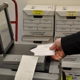 Brown County Deputy Clerk Justin Schmit feeds a ballot into the new voting machine. (Photo from FOX 11). Brown County Deputy Clerk Justin Schmit feeds a ballot into the new voting machine. (Photo from FOX 11).