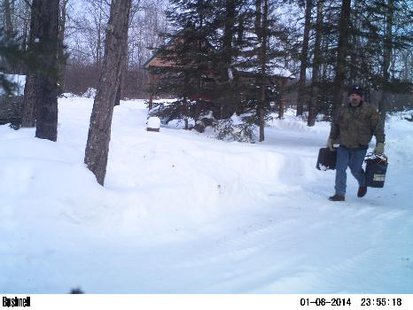 Travis Hamm, photographed by a hidden Bushnell trail camera at the scene of a burglary. Travis Hamm, photographed by a hidden Bushnell trail camera at the scene of a burglary.