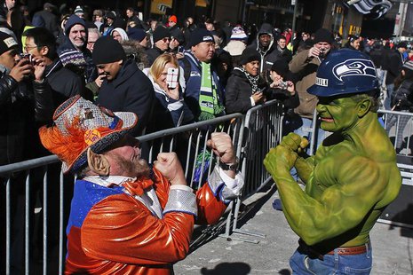 A fan of Seattle Seahawks (R) jokes with a fan of Denver Broncos at the Super Bowl Boulevard fan zone ahead of Super Bowl XLVIII in New York A fan of Seattle Seahawks (R) jokes with a fan of Denver Broncos at the Super Bowl Boulevard fan zone ahead of Super Bowl XLVIII in New York