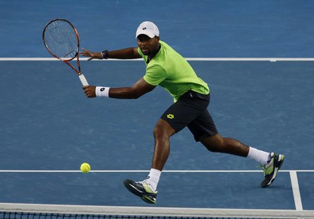 Donald Young of the United States plays a return to Kei Nishikori of Japan during their men's singles match at the Australian Open 2014 tenn Donald Young of the United States plays a return to Kei Nishikori of Japan during their men's singles match at the Australian Open 2014 tenn