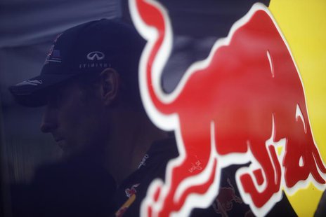 Red Bull Formula One driver Mark Webber of Australia is reflected against the Red Bull logo after the qualifying session of the Brazilian F1 Red Bull Formula One driver Mark Webber of Australia is reflected against the Red Bull logo after the qualifying session of the Brazilian F1