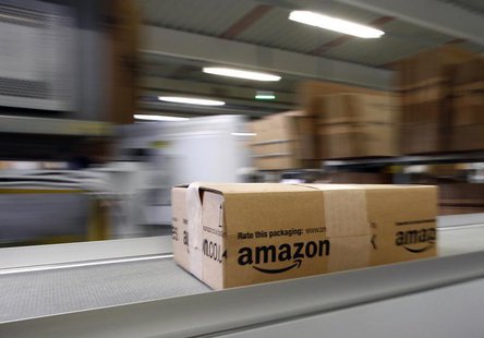 A parcel moves on the conveyor belt at Amazon's logistics centre in Graben near Augsburg December 16, 2013. REUTERS/Michaela Rehle A parcel moves on the conveyor belt at Amazon's logistics centre in Graben near Augsburg December 16, 2013. REUTERS/Michaela Rehle