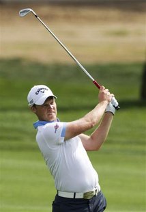 Danny Willett of England takes a shot on the 9th fairway during the second round of the 2014 Omega Dubai Desert Classic in Dubai January 31, Danny Willett of England takes a shot on the 9th fairway during the second round of the 2014 Omega Dubai Desert Classic in Dubai January 31,