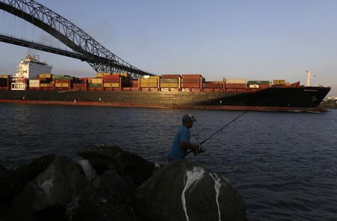 A cargo ship sails under the Bridge of the Americas on the Pacific side of the Panama Canal in Panama City January 16, 2014. REUTERS/Carlos A cargo ship sails under the Bridge of the Americas on the Pacific side of the Panama Canal in Panama City January 16, 2014. REUTERS/Carlos