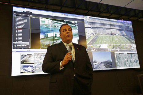 New Jersey Gov. Chris Christie speaks in front of a group of monitors as he visits the Super Bowl security operations center in East Rutherf New Jersey Gov. Chris Christie speaks in front of a group of monitors as he visits the Super Bowl security operations center in East Rutherf