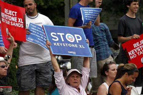 Protesters rally about the Keystone XL oil pipeline along U.S. President Barack Obama's motorcade as he arrives at the Jefferson Hotel in Wa Protesters rally about the Keystone XL oil pipeline along U.S. President Barack Obama's motorcade as he arrives at the Jefferson Hotel in Wa