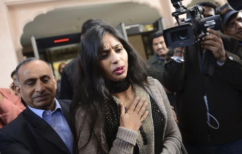 Indian diplomat Devyani Khobragade (C) leaves with her father Uttam Khobragade (L) from the Maharashtra Sadan state guesthouse to meet India Indian diplomat Devyani Khobragade (C) leaves with her father Uttam Khobragade (L) from the Maharashtra Sadan state guesthouse to meet India