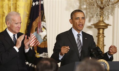 U.S. President Barack Obama (R) stands next to Vice President Joseph Biden as he discusses unemployment, in the East Room of the White House U.S. President Barack Obama (R) stands next to Vice President Joseph Biden as he discusses unemployment, in the East Room of the White House