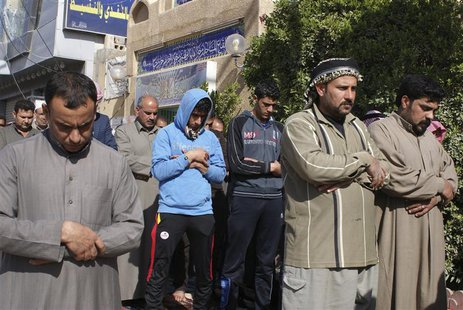 Sunni Muslims attend Friday prayers in the city of Falluja, 70 km (44 miles) west of Baghdad January 31, 2014. REUTERS/Stringer Sunni Muslims attend Friday prayers in the city of Falluja, 70 km (44 miles) west of Baghdad January 31, 2014. REUTERS/Stringer