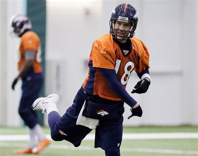 Denver Broncos quarterback Peyton Manning follows through as he passes during their practice session for the Super Bowl at the New York Jets Denver Broncos quarterback Peyton Manning follows through as he passes during their practice session for the Super Bowl at the New York Jets