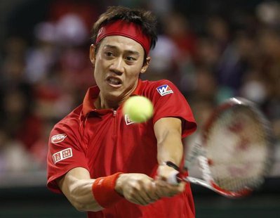 Japan's Kei Nishikori returns a shot against Canada's Frank Dancevic during their Davis Cup world group first round tennis match in Tokyo Fe Japan's Kei Nishikori returns a shot against Canada's Frank Dancevic during their Davis Cup world group first round tennis match in Tokyo Fe
