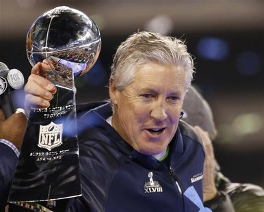 Seattle Seahawks head coach Pete Carroll holds the Vince Lombardi trophy after the Seahawks defeated the Denver Broncos in the NFL Super Bow Seattle Seahawks head coach Pete Carroll holds the Vince Lombardi trophy after the Seahawks defeated the Denver Broncos in the NFL Super Bow