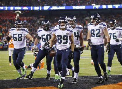 Seattle Seahawks wide receiver Doug Baldwin (89) celebrates his touchdown against the Denver Broncos with teammates during the fourth quarte Seattle Seahawks wide receiver Doug Baldwin (89) celebrates his touchdown against the Denver Broncos with teammates during the fourth quarte