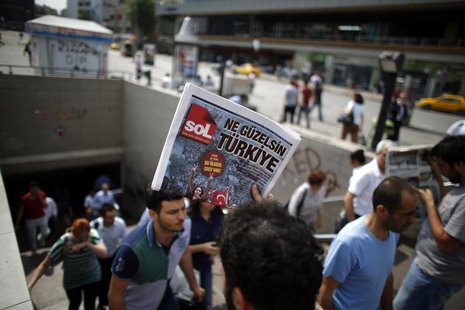 A man sells newspapers to people as they leave the subway station at Taksim Square in Istanbul June 4, 2013. REUTERS/Stoyan Nenov A man sells newspapers to people as they leave the subway station at Taksim Square in Istanbul June 4, 2013. REUTERS/Stoyan Nenov