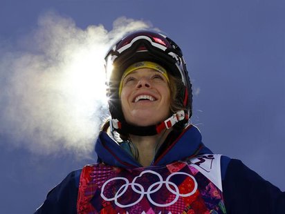 U.S. mogul skier Hannah Kearney looks up at the mountain while taking a break during a night training session for the 2014 Sochi Winter Olym U.S. mogul skier Hannah Kearney looks up at the mountain while taking a break during a night training session for the 2014 Sochi Winter Olym
