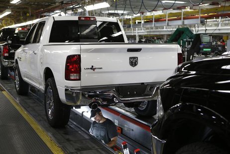 Chrysler Group assembly staff works below a 2014 Dodge Ram pickup truck at the Warren Assembly Plant in Warren, Michigan December 11, 2013. Chrysler Group assembly staff works below a 2014 Dodge Ram pickup truck at the Warren Assembly Plant in Warren, Michigan December 11, 2013.