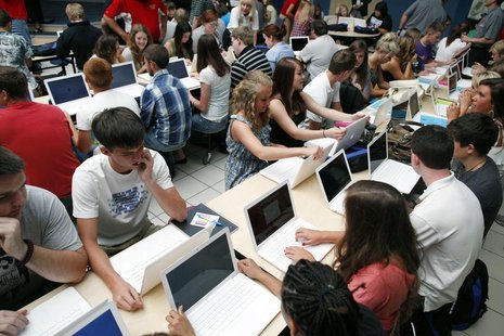 Students set up their donated laptop computers on the first day of school at Joplin High School in Joplin, Missouri August 17, 2011. REUTERS Students set up their donated laptop computers on the first day of school at Joplin High School in Joplin, Missouri August 17, 2011. REUTERS